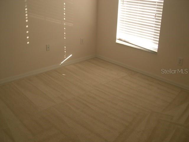 13015 Kings Crossing Drive Gibsonton, FL 33534 - Photo 3 of 8 a view of an empty room with a window