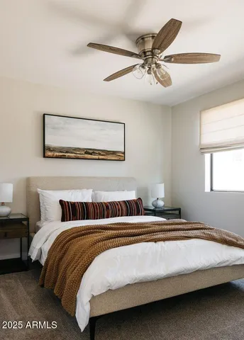 a bedroom with a bed and window