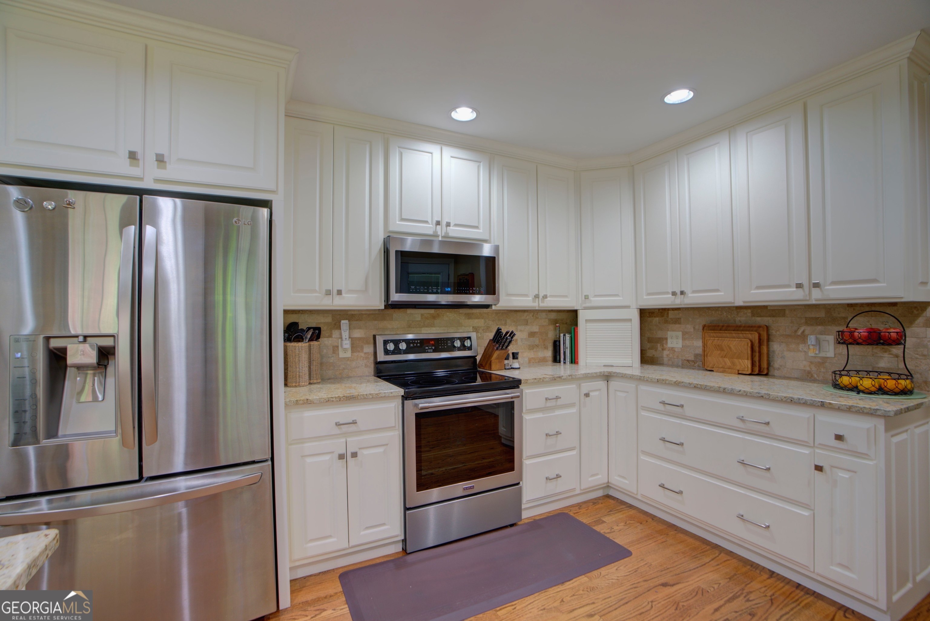 204 Green View Road Southwest Rome, GA 30165 - Photo 29 of 62 a kitchen with white cabinets stainless steel appliances and a window