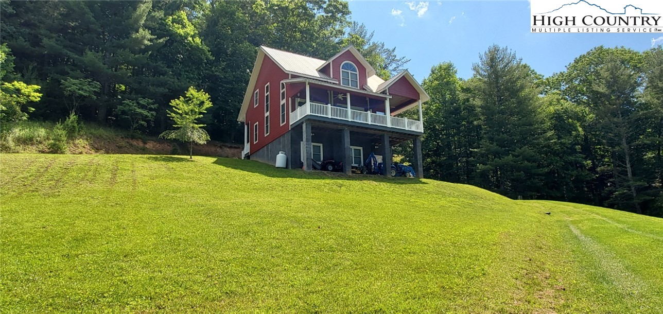 292-294 Wildcat Ridge Road Deep Gap, NC 28618 - Photo 1 of 49 a view of a house with a yard