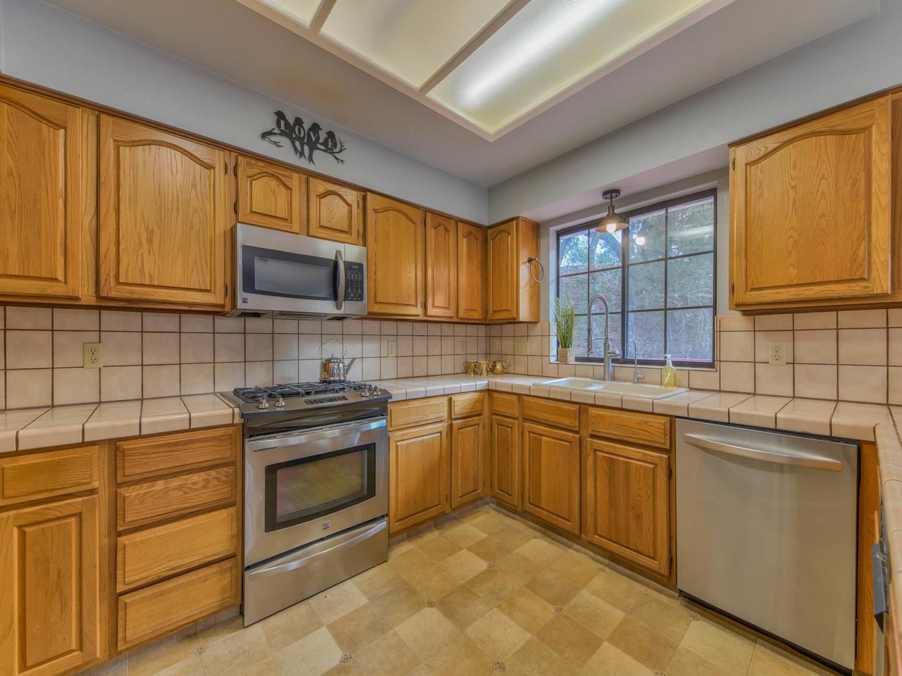 6640 Kim Ann Lane Salinas, CA 93907 - Photo 14 of 41 a kitchen with sink cabinets and window