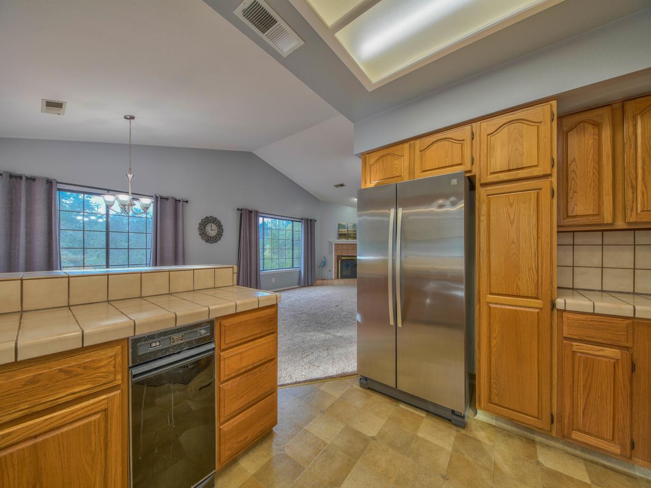 6640 Kim Ann Lane Salinas, CA 93907 - Photo 16 of 41 a kitchen with stainless steel appliances granite countertop a refrigerator and a stove