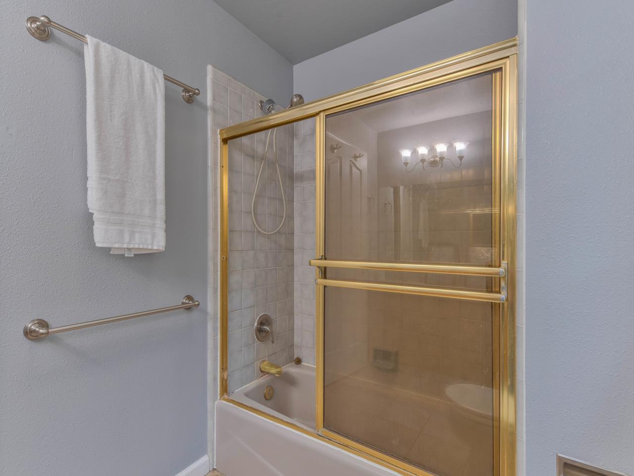 6640 Kim Ann Lane Salinas, CA 93907 - Photo 22 of 41 a bathroom with a glass shower door