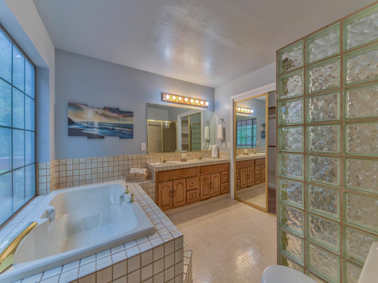 6640 Kim Ann Lane Salinas, CA 93907 - Photo 35 of 41 a bathroom with a tub sink and mirror