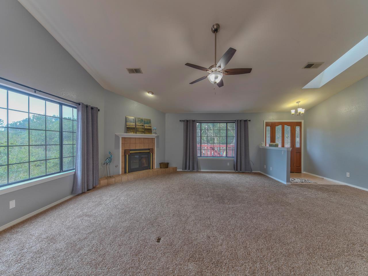 6640 Kim Ann Lane Salinas, CA 93907 - Photo 7 of 41 a view of an empty room with a fireplace and a large window