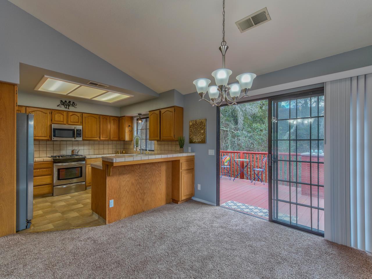 6640 Kim Ann Lane Salinas, CA 93907 - Photo 10 of 41 a view of a kitchen with refrigerator stove and wooden floor