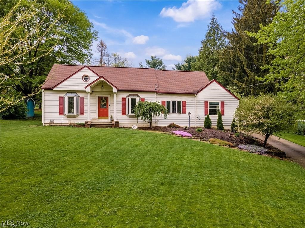 Single story home featuring a front yard