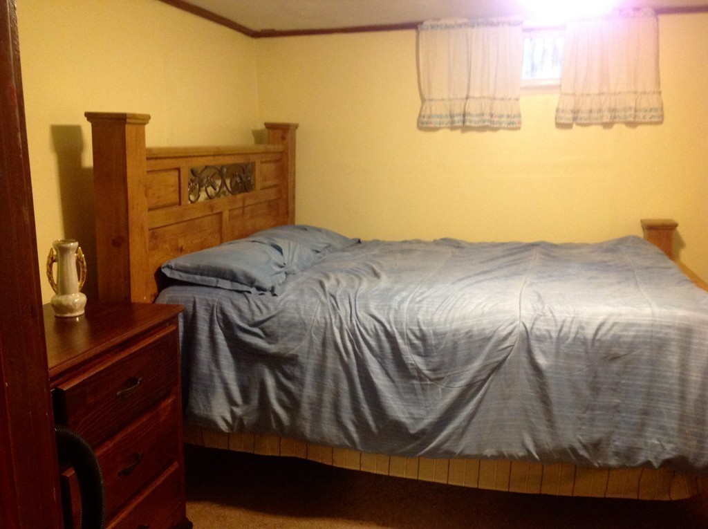 122 Redlands Street Springfield, MA 01104 - Photo 13 of 13 a bedroom with a bed and a window