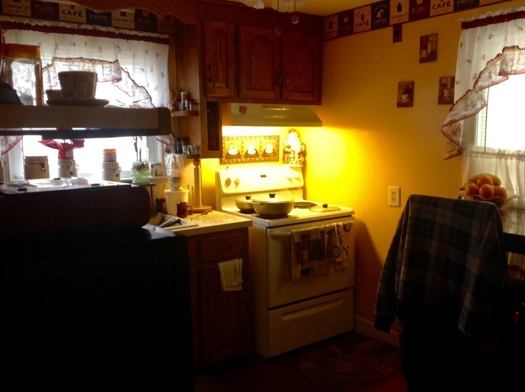122 Redlands Street Springfield, MA 01104 - Photo 6 of 13 a view of kitchen with stainless steel appliances granite countertop a stove and a refrigerator
