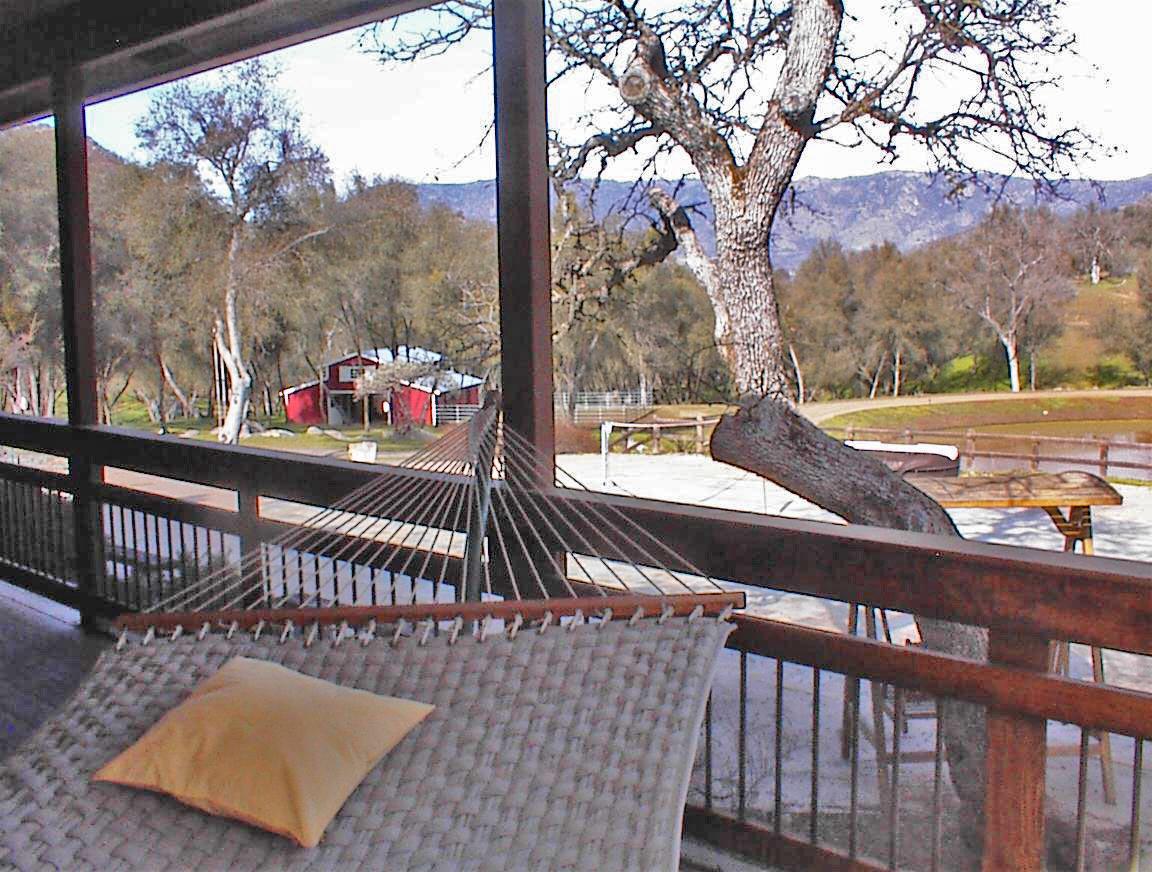 45483 Sand Creek Road Squaw Valley, CA 93675 - Photo 15 of 80 a view of a two chairs and table in the balcony