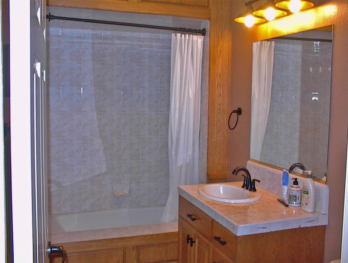 45483 Sand Creek Road Squaw Valley, CA 93675 - Photo 34 of 80 a bathroom with a sink and a mirror