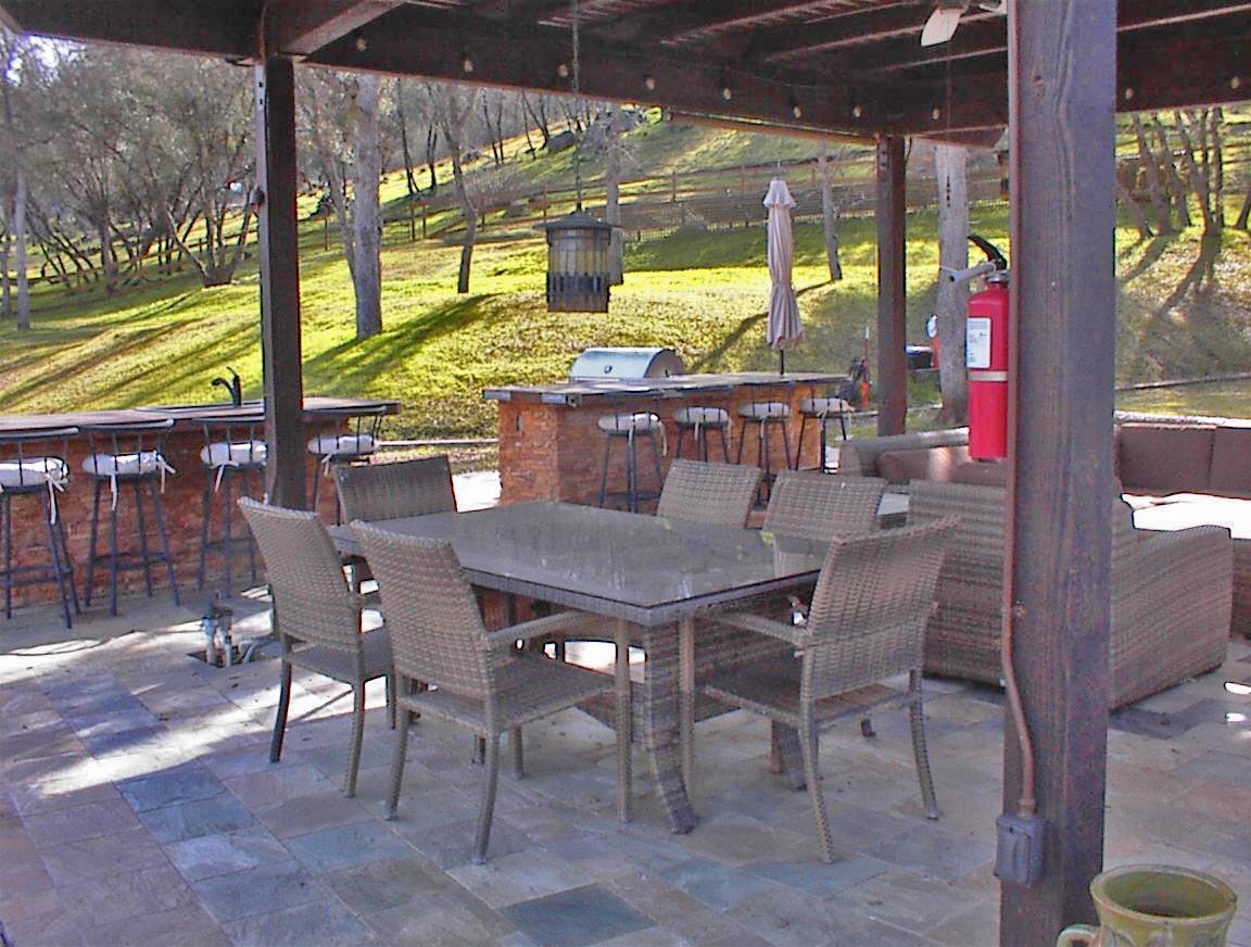 45483 Sand Creek Road Squaw Valley, CA 93675 - Photo 42 of 80 a view of a patio with a table and chairs