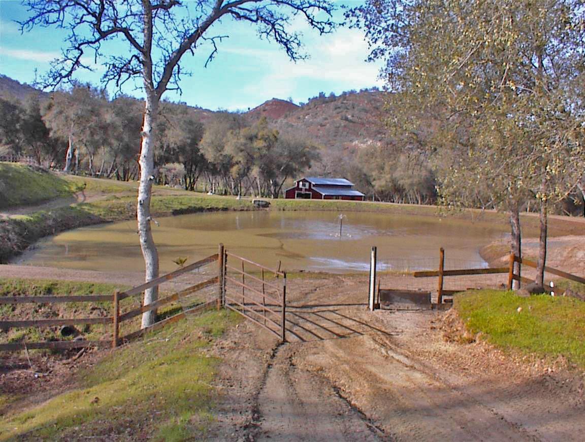45483 Sand Creek Road Squaw Valley, CA 93675 - Photo 45 of 80 a view of a lake with a mountain and a table and chairs