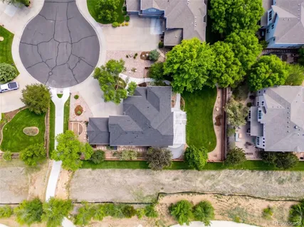 an aerial view of a house with yard swimming pool and outdoor seating