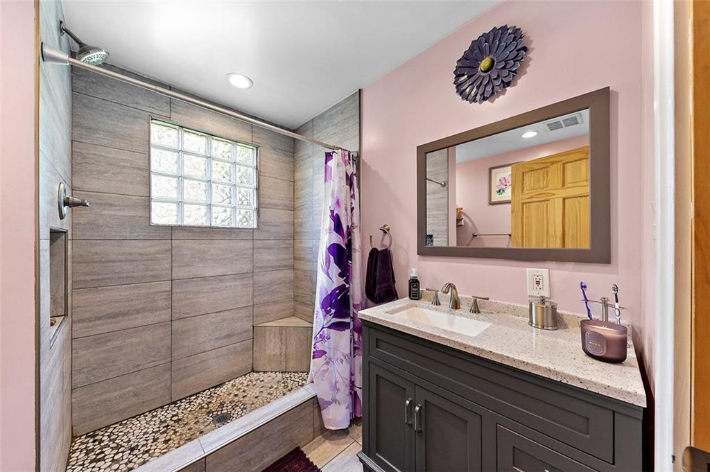 318 Earlwood Road Pittsburgh, PA 15235 - Photo 18 of 33 A 1st floor bathroom features a huge walk-in shower and a double-wide vanity