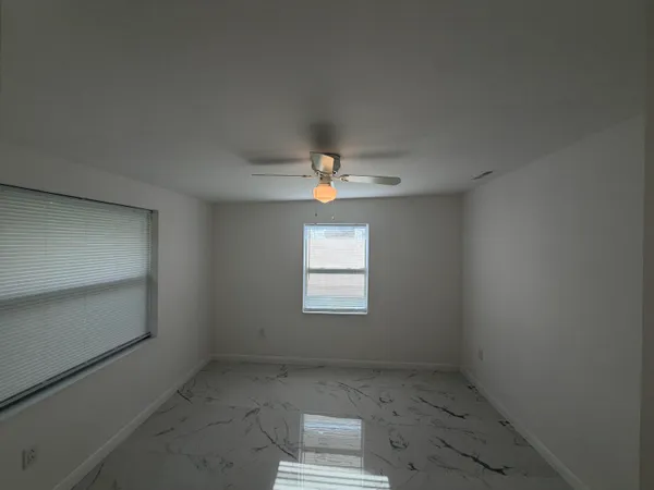 an empty room that has a window