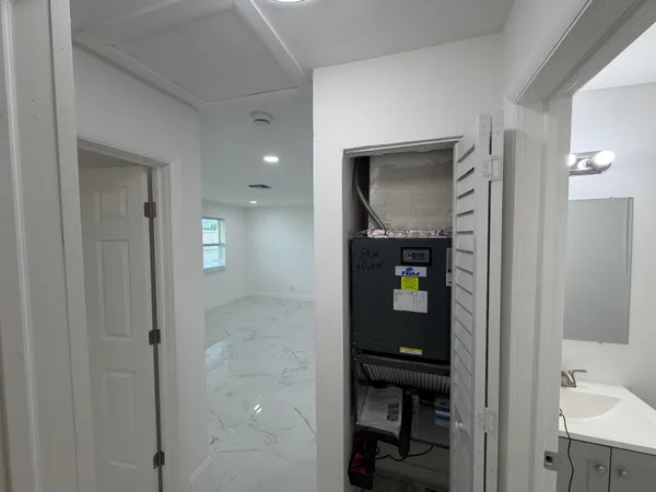 a bathroom with a shower and a sink