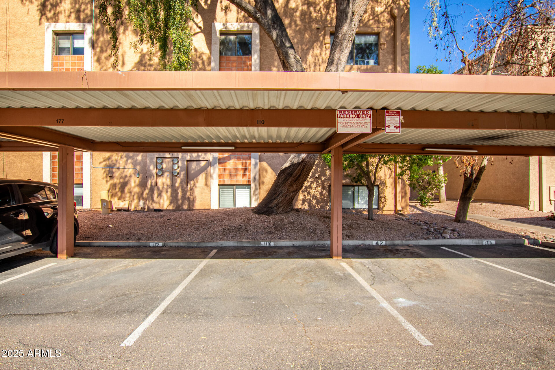 3031 North Civic Center Plaza, Unit 229 Scottsdale, AZ 85251 - Photo 16 of 20 a view of outdoor space garage and tree