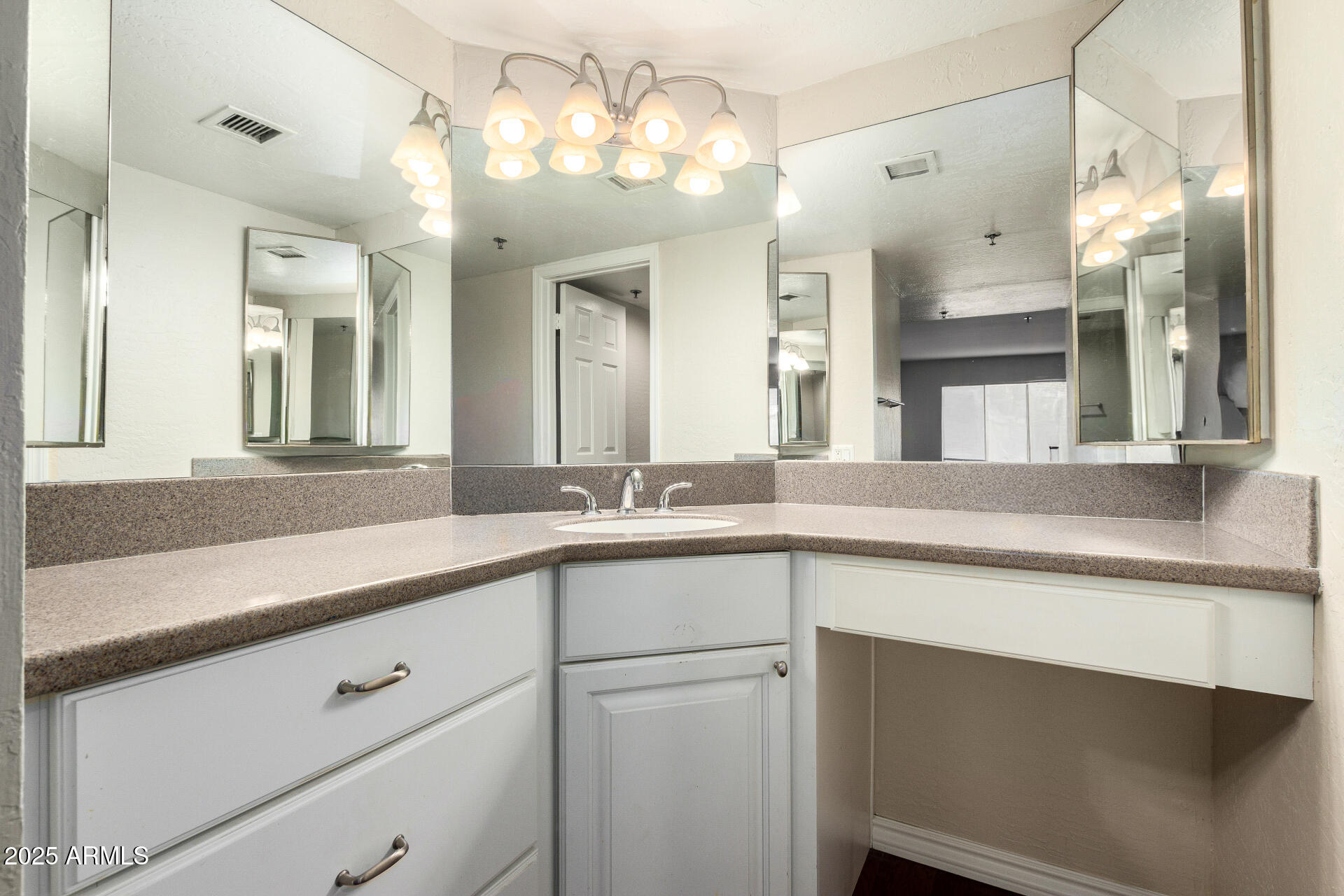 3031 North Civic Center Plaza, Unit 229 Scottsdale, AZ 85251 - Photo 9 of 20 a bathroom with a sink vanity and a mirror