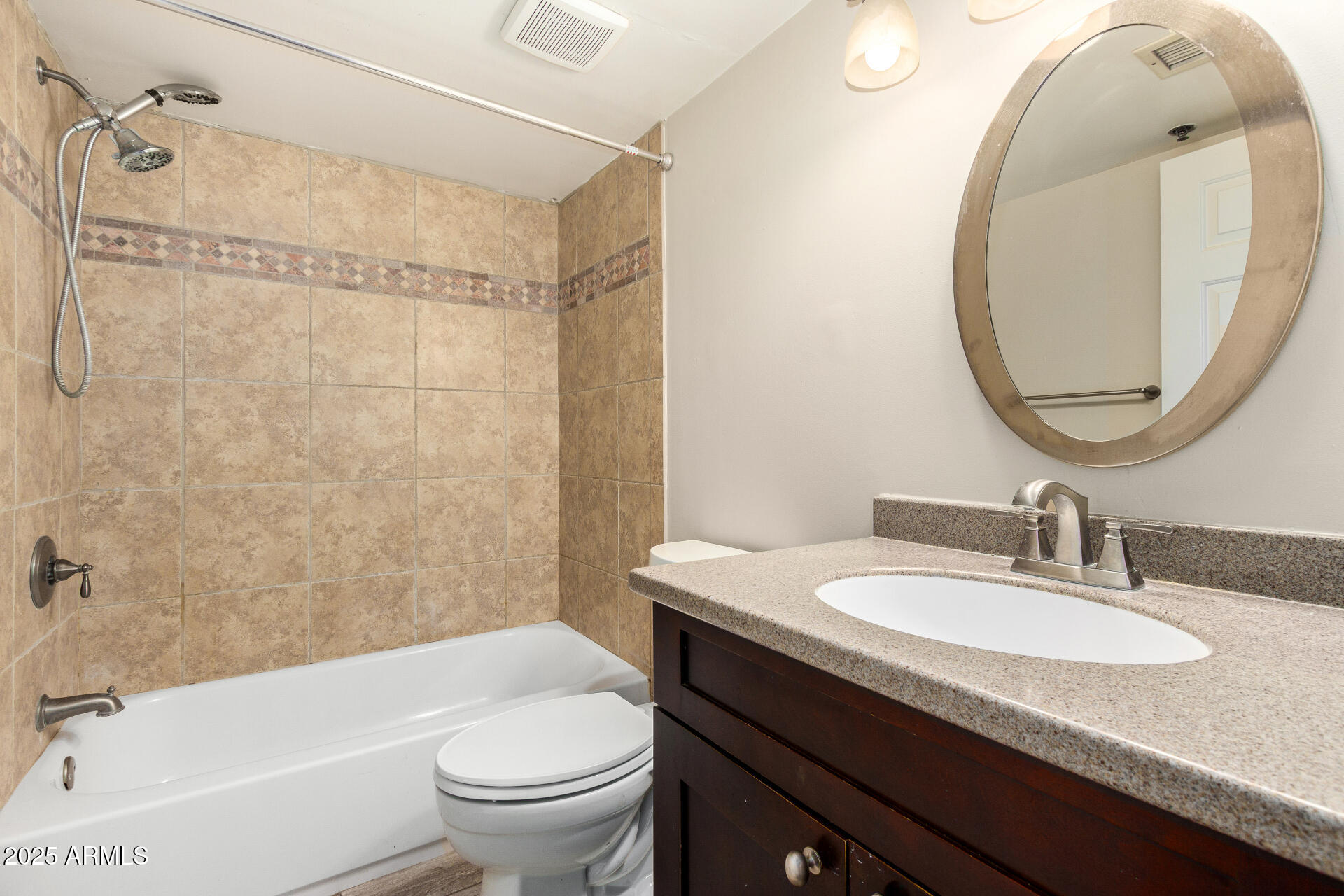 3031 North Civic Center Plaza, Unit 229 Scottsdale, AZ 85251 - Photo 10 of 20 a bathroom with a granite countertop sink toilet and shower