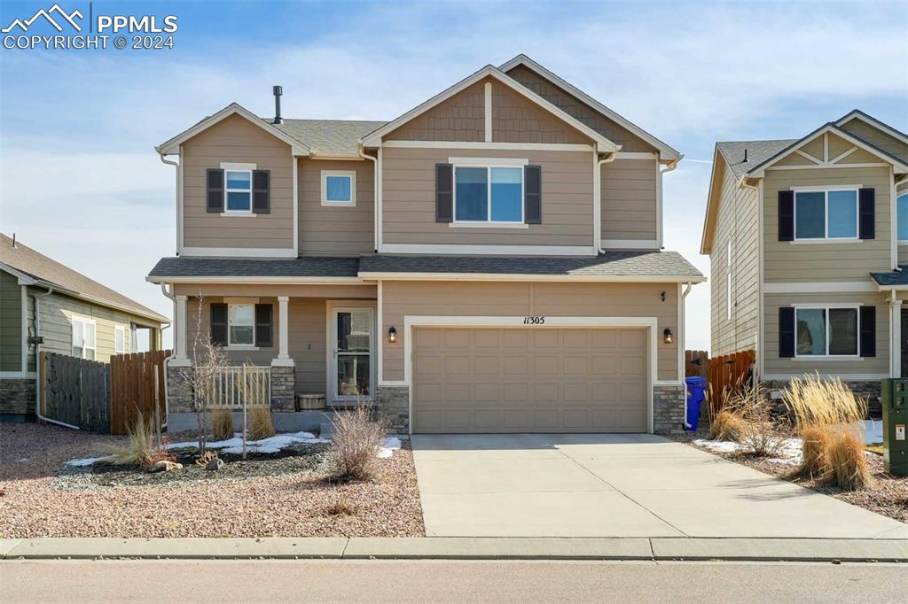 11305 Avena Road Peyton, CO 80831 - Photo 2 of 47 a front view of a house with entertaining space