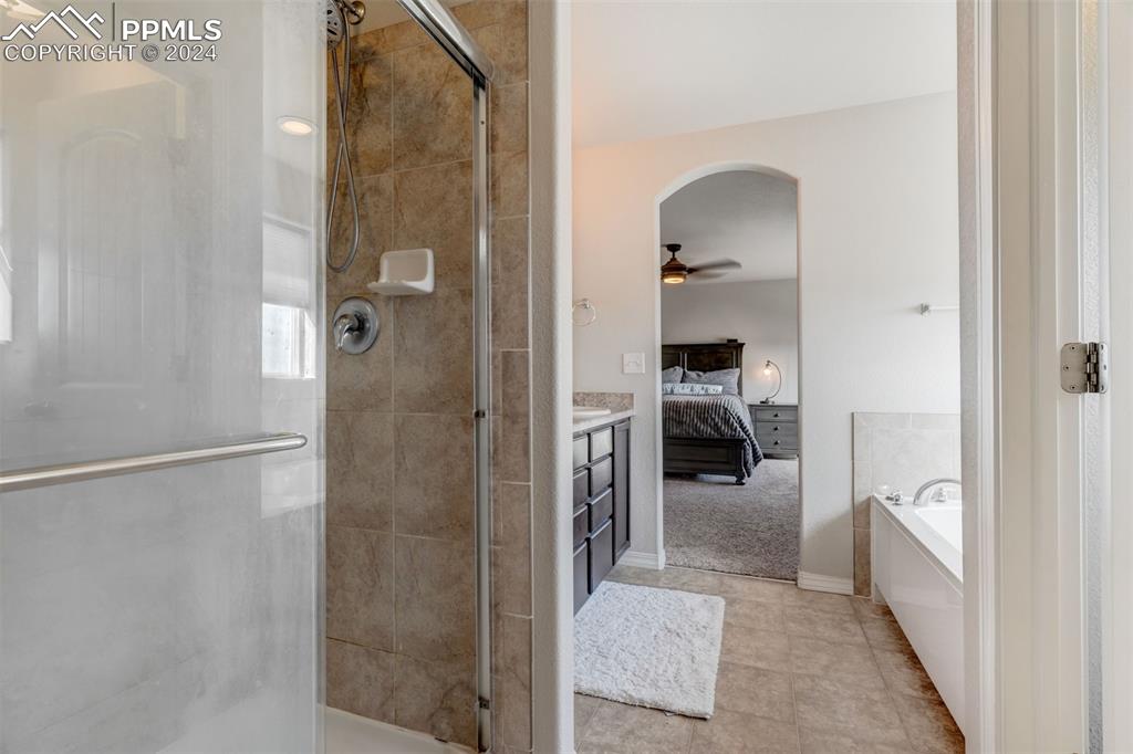 11305 Avena Road Peyton, CO 80831 - Photo 25 of 47 a walk in closet and bathroom