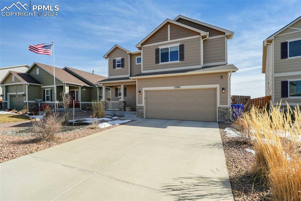 11305 Avena Road Peyton, CO 80831 - Photo 3 of 47 a front view of a house with a yard