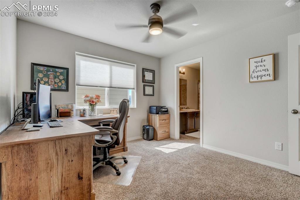 11305 Avena Road Peyton, CO 80831 - Photo 33 of 47 a view of a workspace with furniture and a window