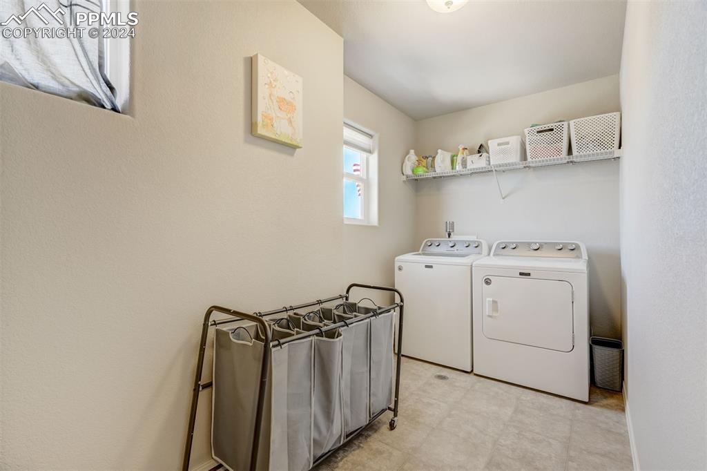 11305 Avena Road Peyton, CO 80831 - Photo 36 of 47 a utility room with dryer and washer