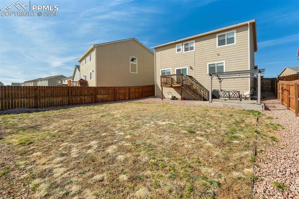 11305 Avena Road Peyton, CO 80831 - Photo 46 of 47 a view of a house with backyard
