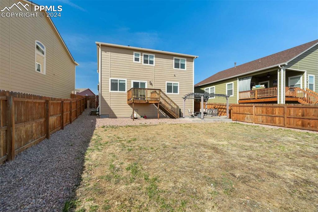 11305 Avena Road Peyton, CO 80831 - Photo 47 of 47 a view of a house with backyard and sitting area