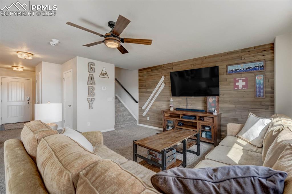 11305 Avena Road Peyton, CO 80831 - Photo 5 of 47 a living room with furniture and a flat screen tv