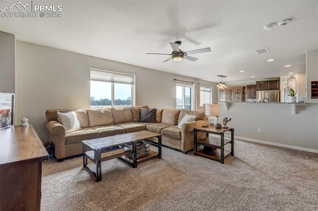 11305 Avena Road Peyton, CO 80831 - Photo 6 of 47 a living room with furniture and a ceiling fan