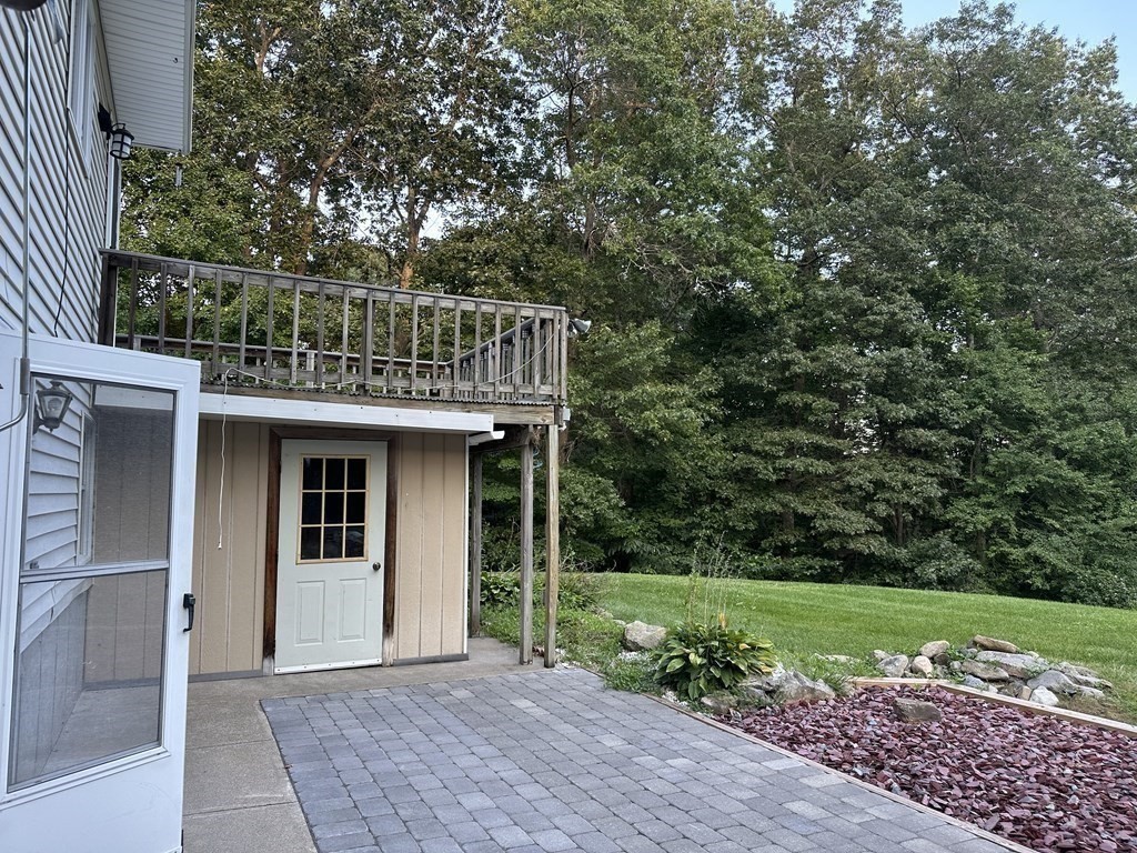 101 Minechoag Heights, Unit 101 Ludlow, MA 01056 - Photo 19 of 20 a front view of a house with garden