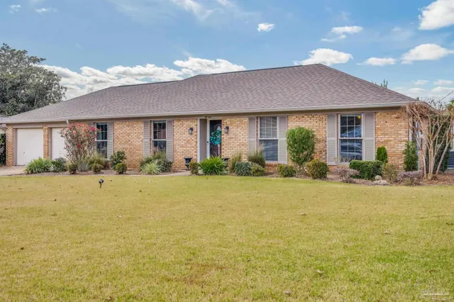 a front view of house with an outdoor space and seating