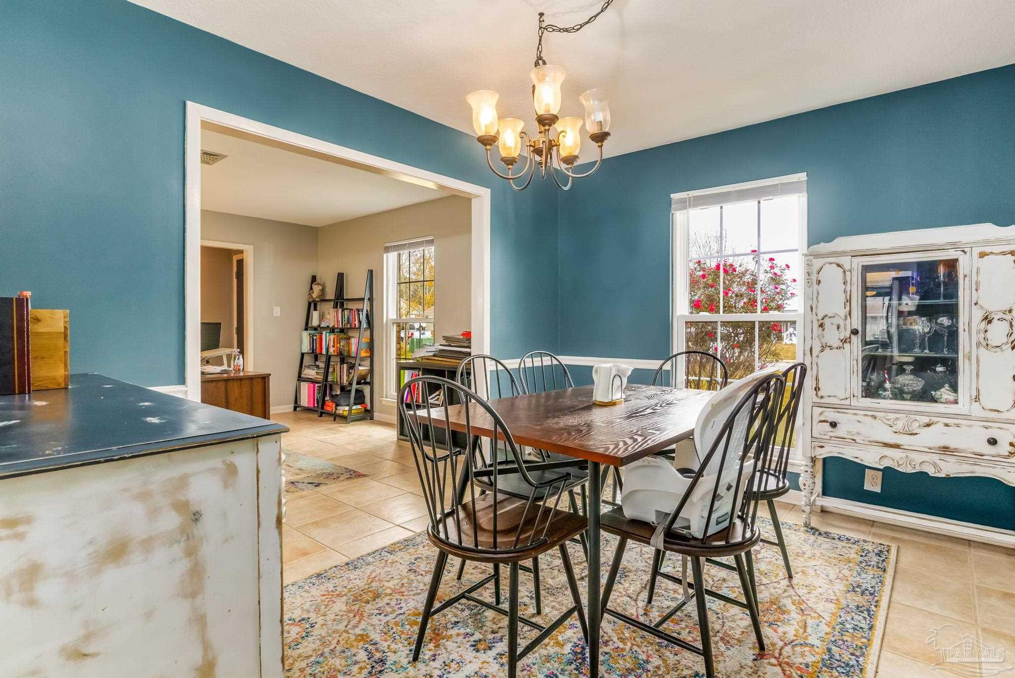 3525 Hopestill Road Pensacola, FL 32503 - Photo 5 of 20 a view of a dining room with furniture and a chandelier