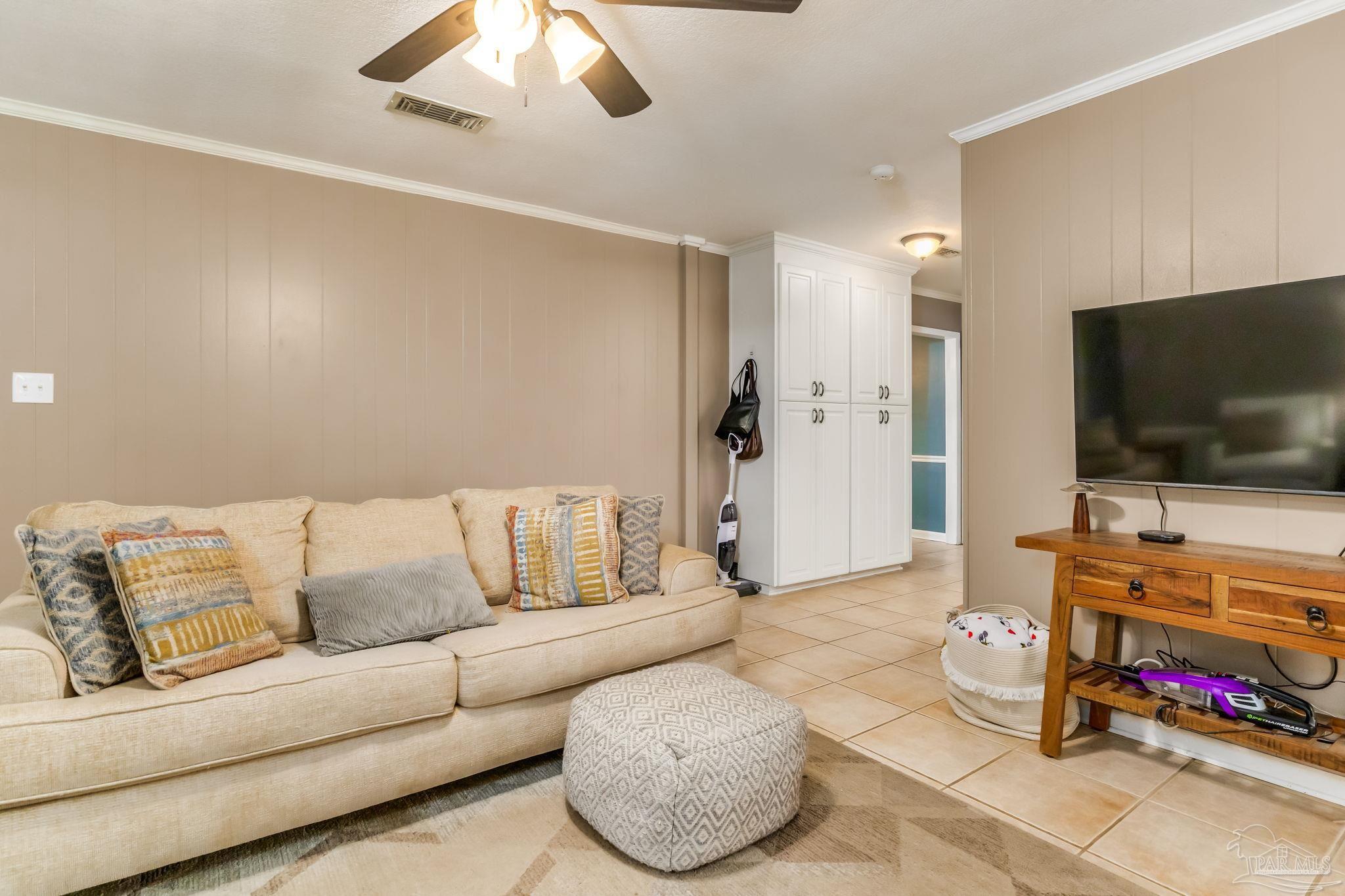 3525 Hopestill Road Pensacola, FL 32503 - Photo 9 of 20 a living room with furniture and a flat screen tv
