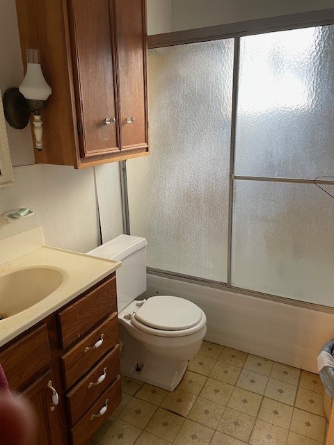 7339 Lewiston Street Houston, TX 77049 - Photo 11 of 23 a bathroom with a granite countertop toilet and a sink