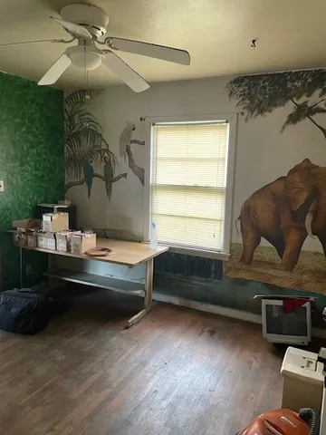 a room with gym equipment and a large window