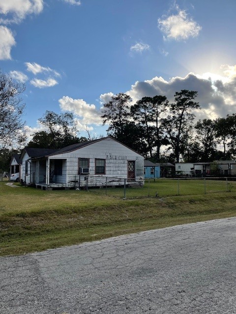 7339 Lewiston Street Houston, TX 77049 - Photo 2 of 23 a front view of a house with a yard
