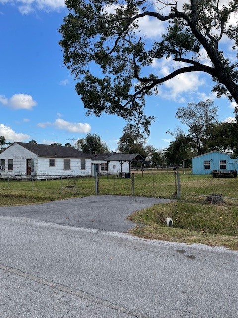 7339 Lewiston Street Houston, TX 77049 - Photo 3 of 23 a view of a big house with a big yard