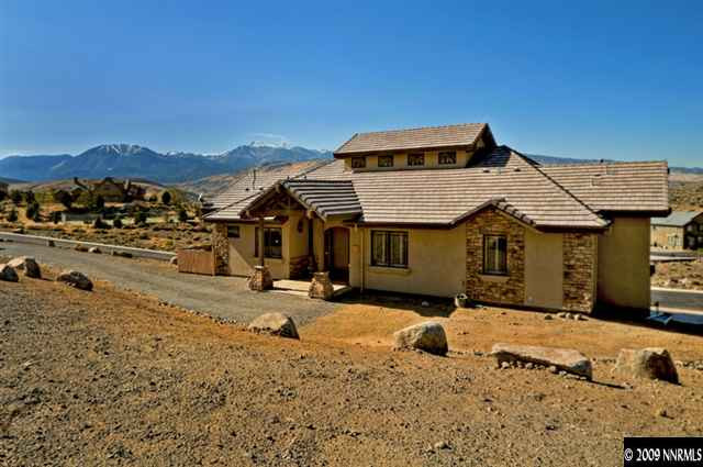 2665 Majestic View Court Reno, NV 89521 - Photo 1 of 9 a front view of a house with a yard covered with snow in front of it