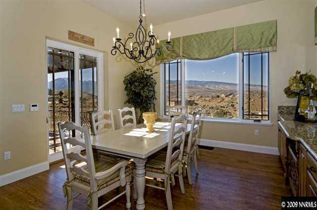 2665 Majestic View Court Reno, NV 89521 - Photo 5 of 9 a view of a dining room with furniture a chandelier and wooden floor