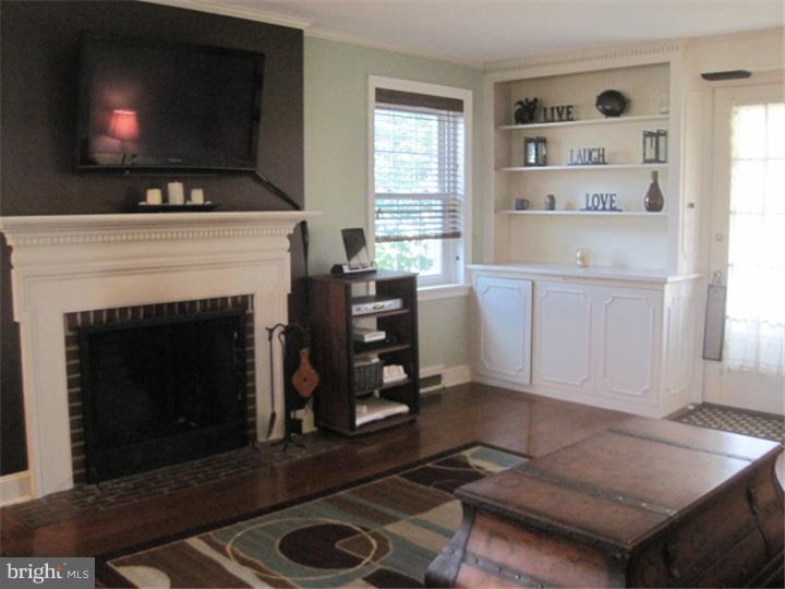 351 Mill Road Havertown, PA 19083 - Photo 4 of 24 a living room with furniture and a fireplace
