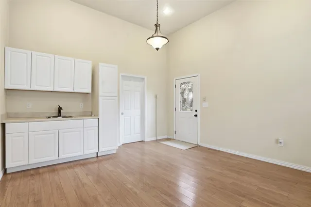 a bathroom with a granite countertop toilet a sink and bathtub