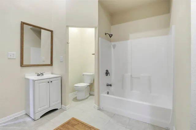 a view of a backyard with large tree