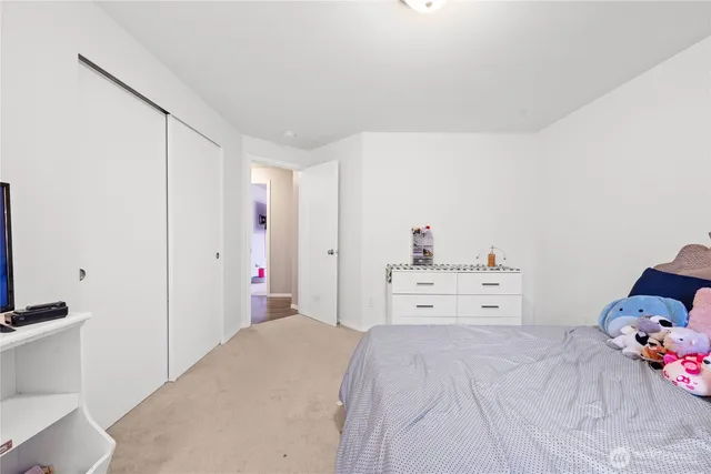 a bedroom with a bed and closet