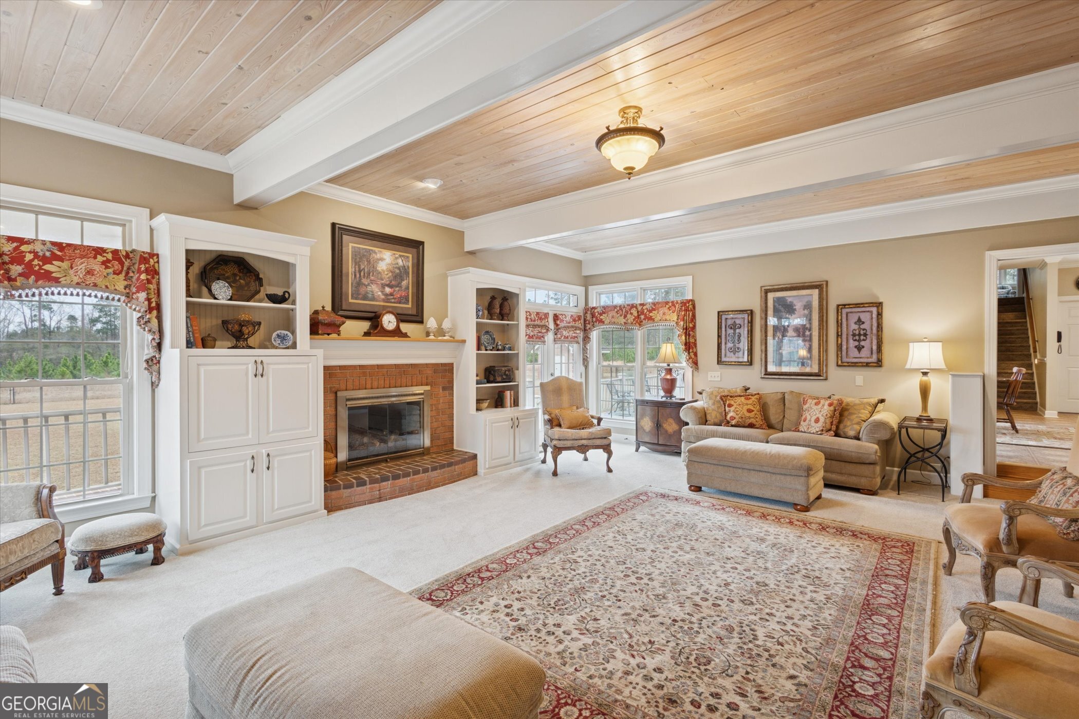 10544 Burkhalter Road Statesboro, GA 30461 - Photo 11 of 67 a living room with furniture and a fireplace