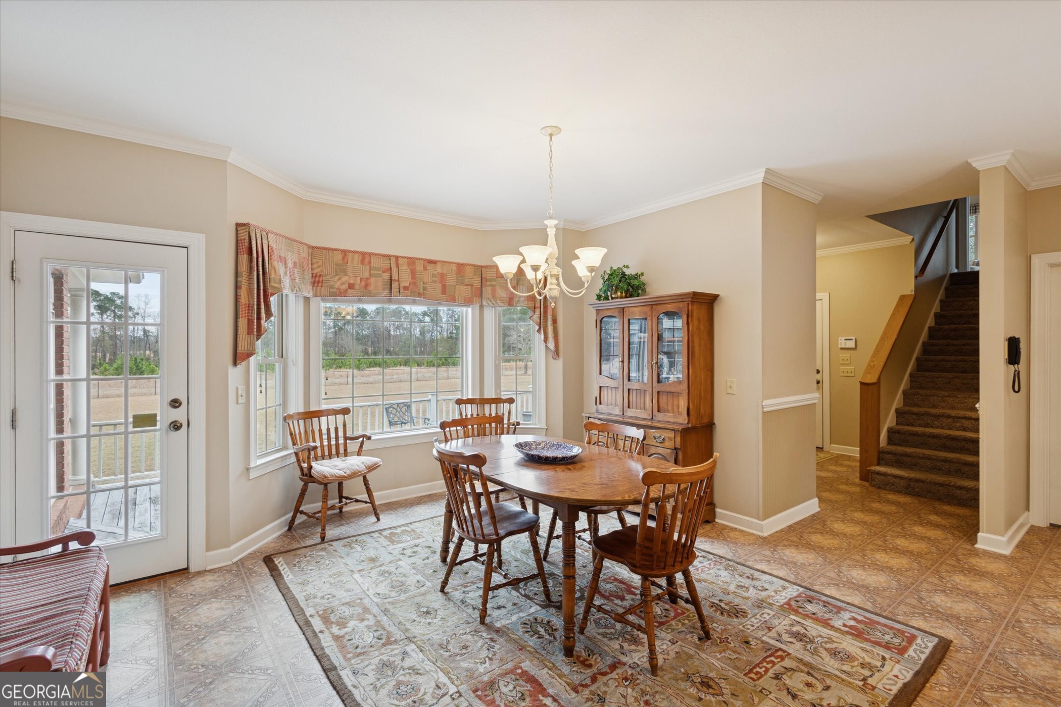 10544 Burkhalter Road Statesboro, GA 30461 - Photo 15 of 67 a view of a dining room with furniture window and outside view