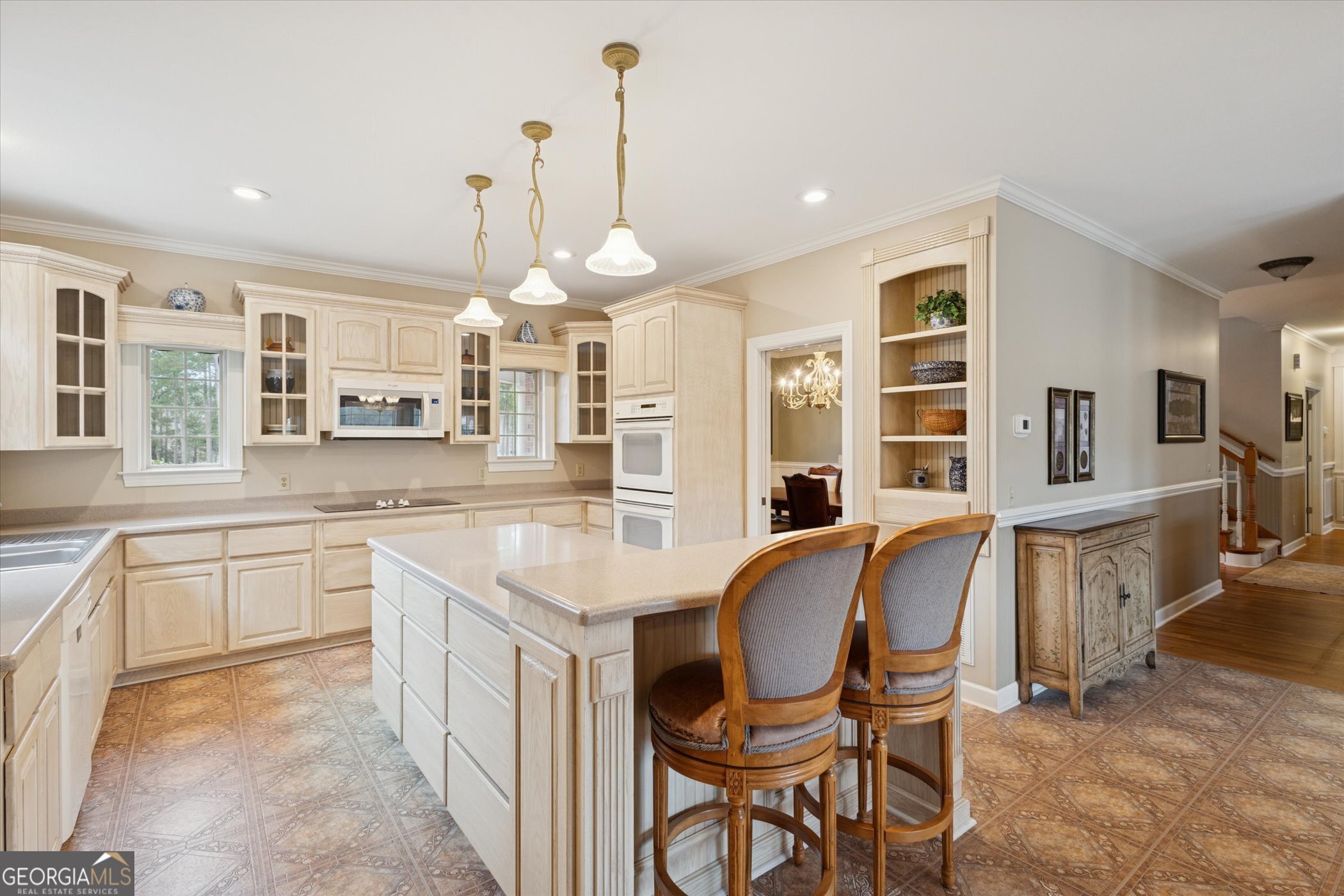 10544 Burkhalter Road Statesboro, GA 30461 - Photo 18 of 67 a large kitchen with a table and chairs